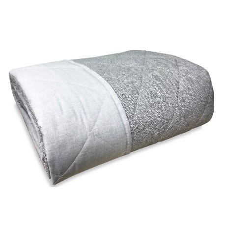 Colcha acolchada sobre gris