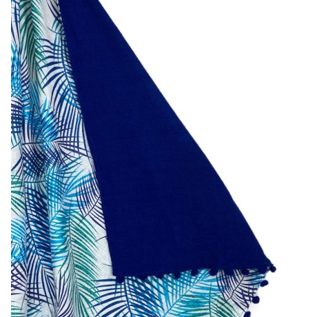 beach towel printed with leaves on blue