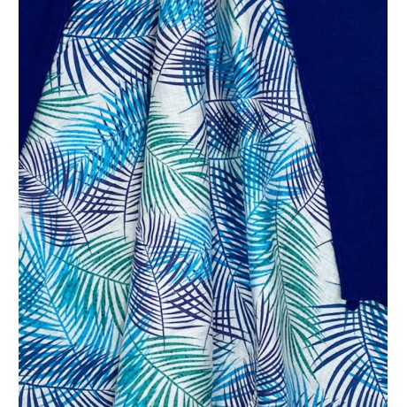 beach towel printed with leaves on blue