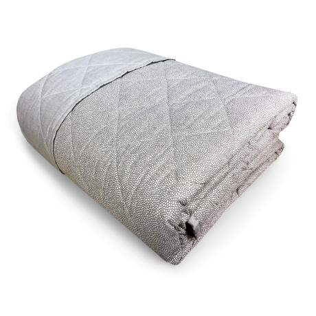 Colcha acolchada sobre beige