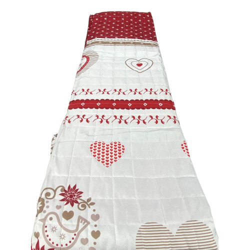 Red Champoluc bedspread folded and packaged in a transparent PVC bag