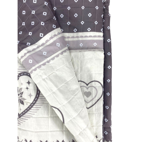 Champoluc dove-grey quilted bedspread - full view with alpine heart motif