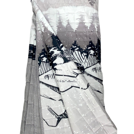 Quilted bedspread with woodland scene and stylized black deer