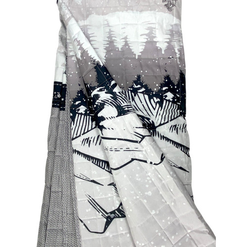 Quilted bedspread with woodland scene and stylized black deer