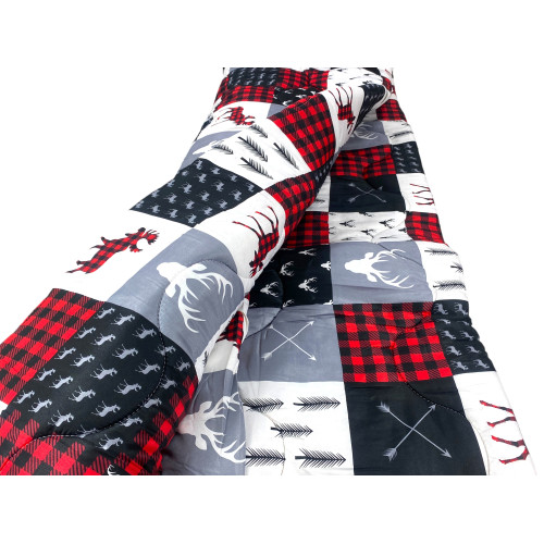 Patchwork quilt detail – graphic motifs with animals and nature
